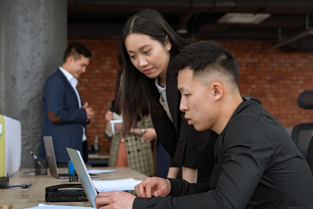 Two business consultant reviewing home service business's margins. | Solutionariez